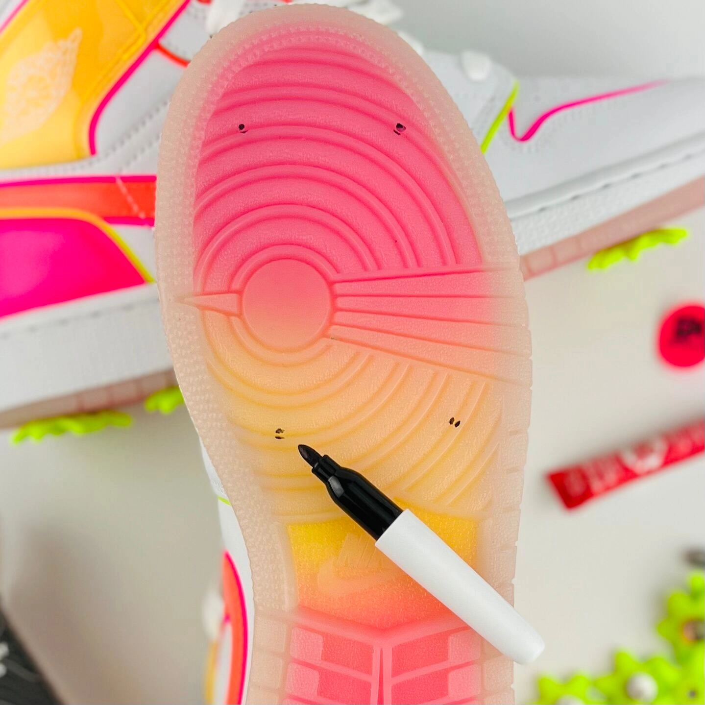 A pink sole with Sharpie dots marking where each spike goes