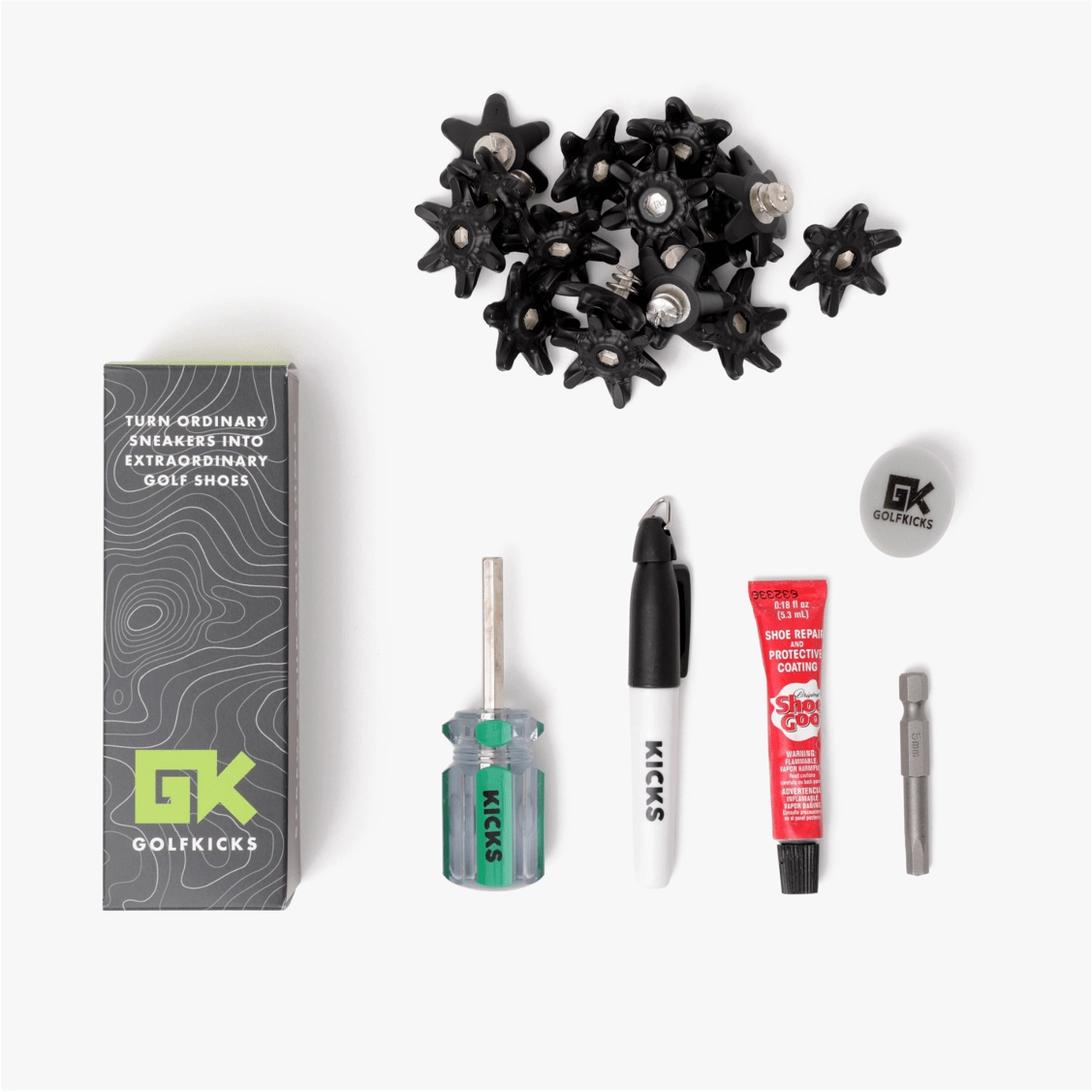 The Golfkicks traction kit laid flat: box, spikes, hex tool, Sharpie and Shoe Goo